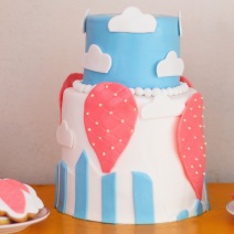 Sweet table with big cake, cupcakes, cake pops